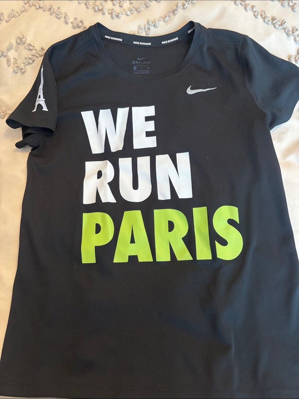 Nike Black Short-Sleeve 'WE RUN PARIS' Tee with White and Lime Green Graphics
